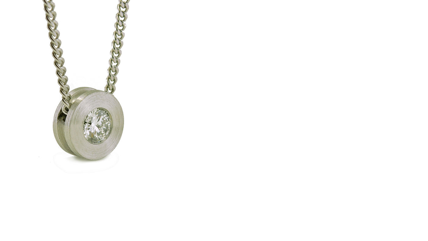 Industrial Style platinum pendant with a diamond.