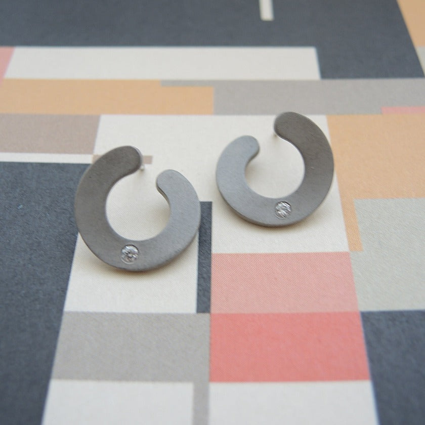 flat silver hoops with offset diamonds