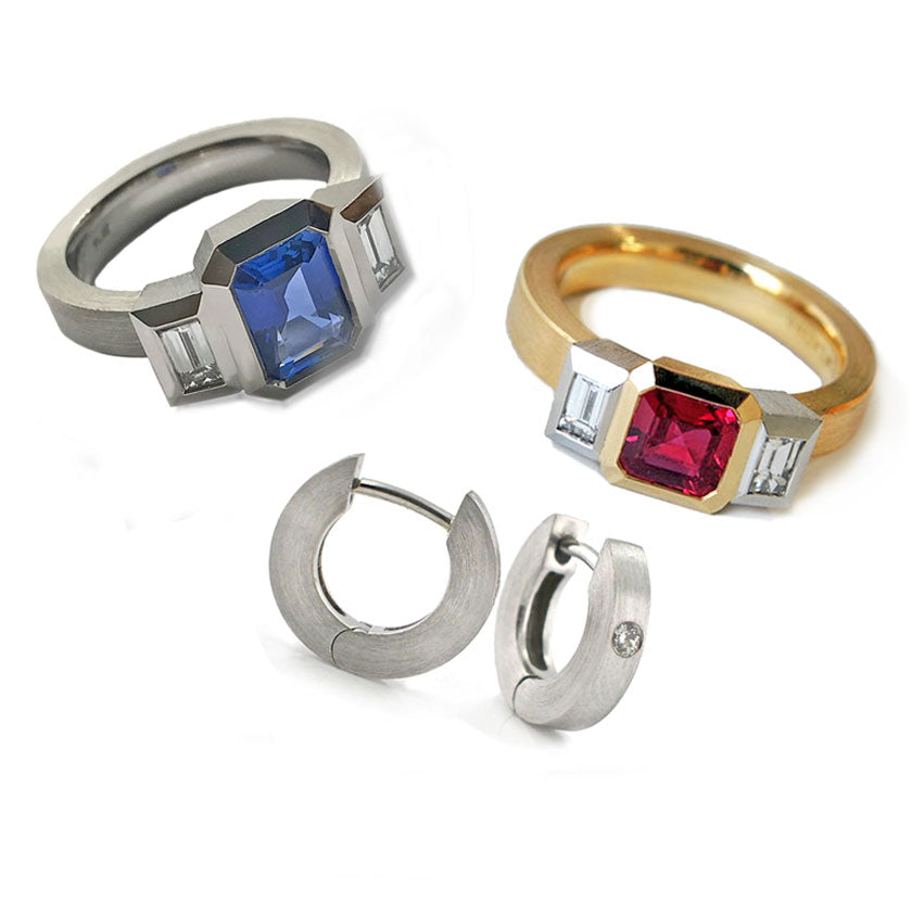 Two 3 stone bezel set rings with gemstones and two platinum hoop earrings on a white background