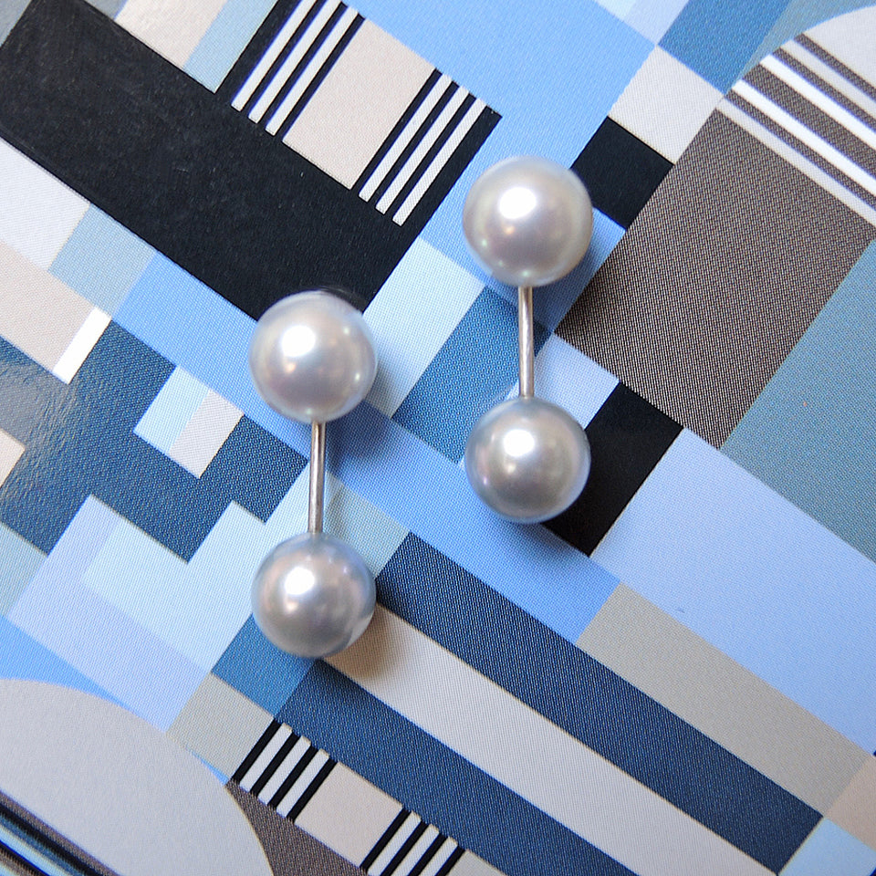 Pale blue pearl studs with pearl jackets on a 9mm stem