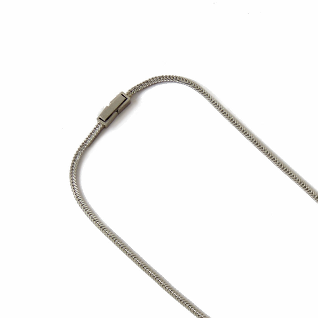 1.6 mm wide x 16" long flat foxtail chain in platinum showing the clasp detail, on a white background