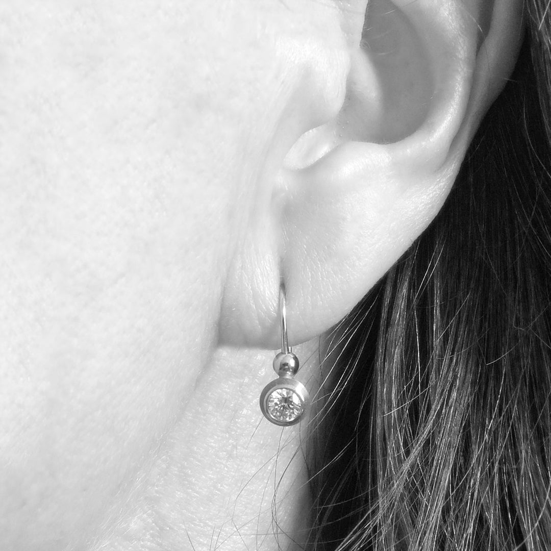 Series 8 - Simplicity | Double Bezel, Lever Back Earrings in Pt950 + Dia. on model