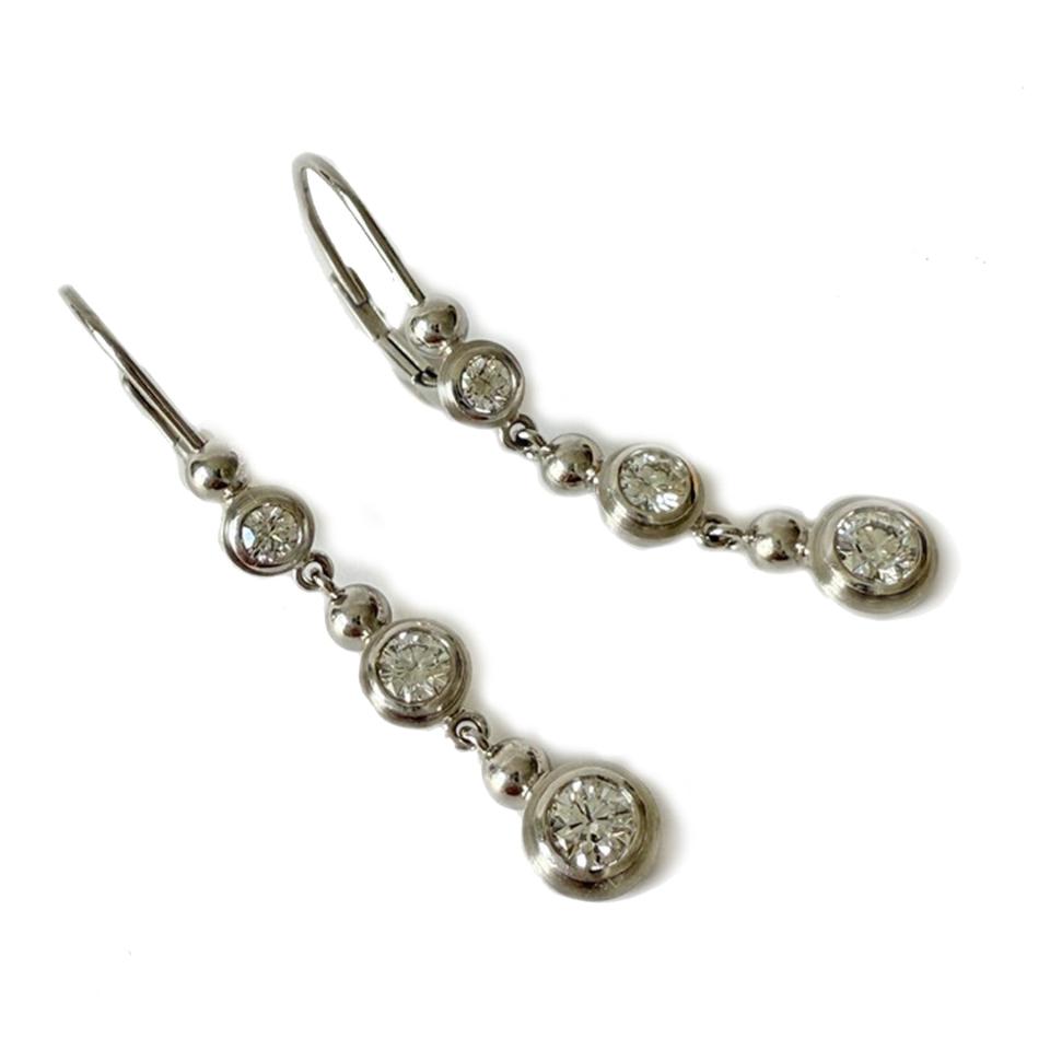 Platinum earwires with 3 bezel set diamnds in each earring