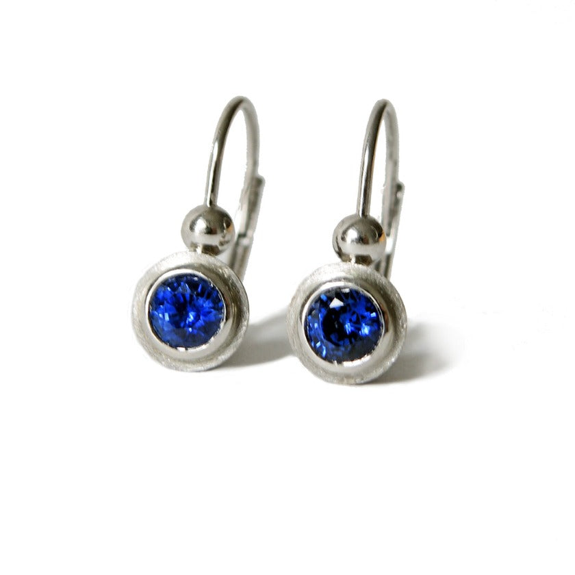 Leverback in platinum with bezel set  4 mm blue sapphires