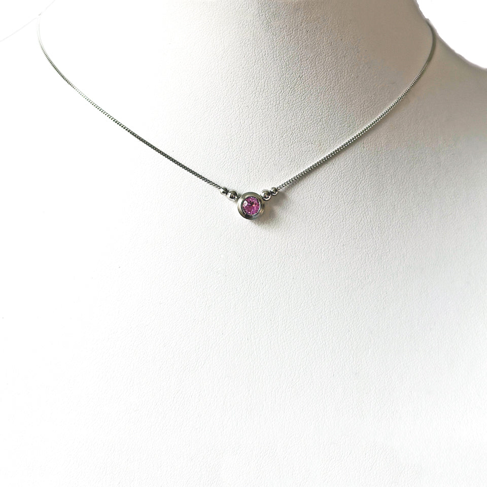 4.4 mm pale pink sapphire set in 18KPW double bezel on a fine adjustable chain