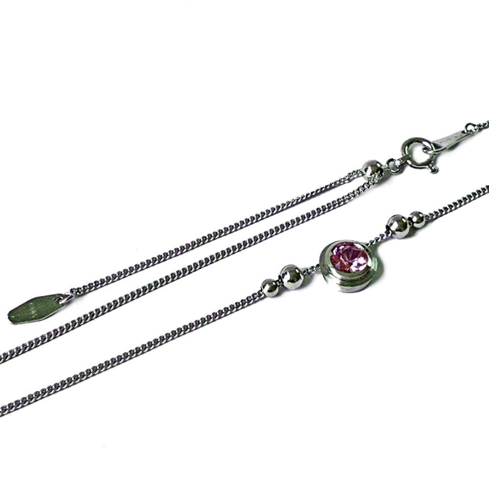 Pink sapphire bezels set in 18KPW with beads on a 1 mm chain.