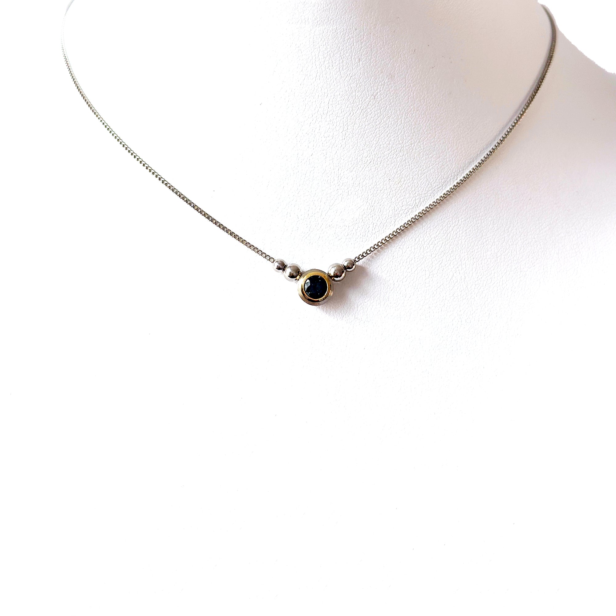 Montana blue-green sapphire bezel set in 18k yellow gold and platinum on a fine chain.