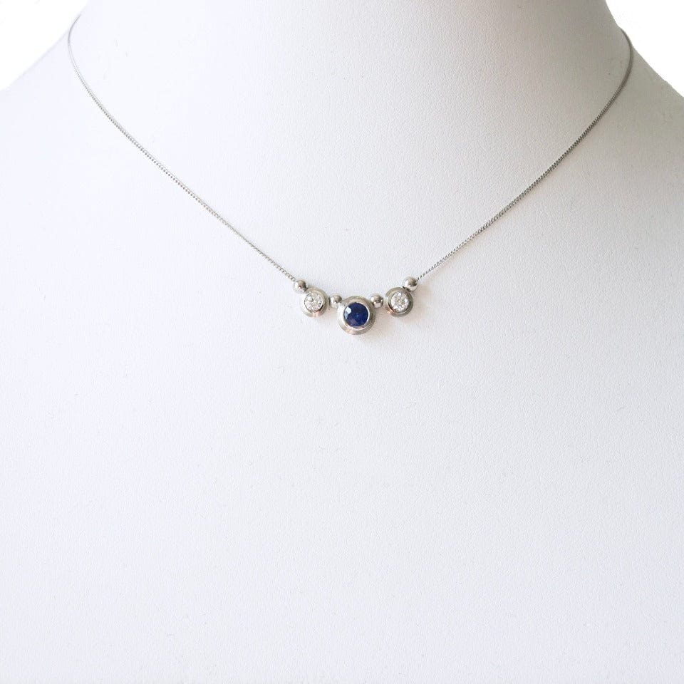 Series 8 - Simplicity | Bezel, Three Stone Pendant in Pt., 4.5 mm Sapphire + Diamonds